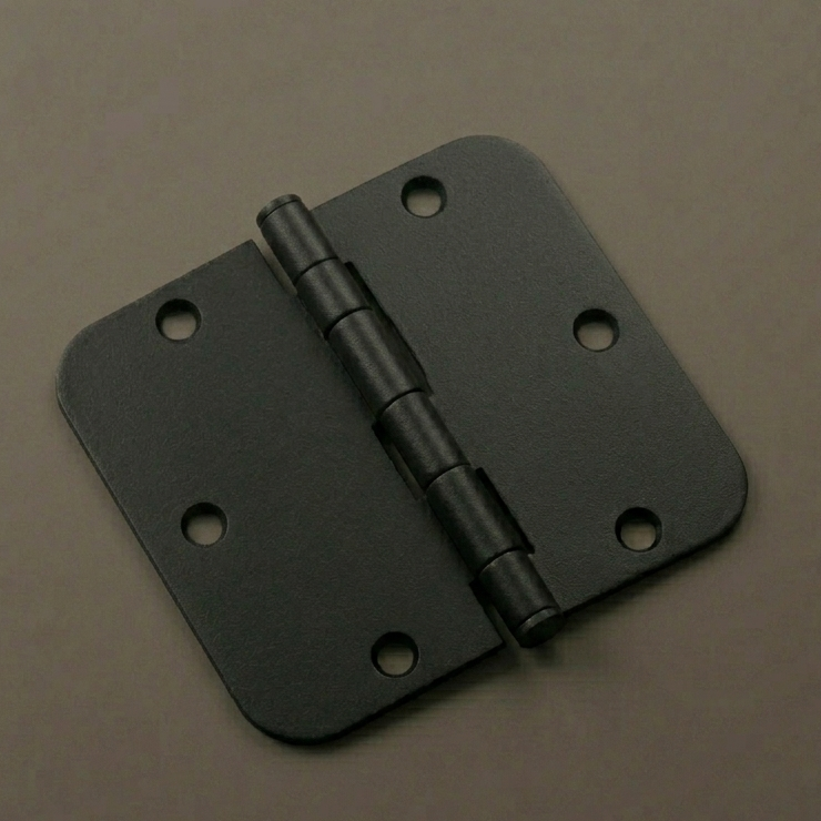 Black metal hinge on a brown background