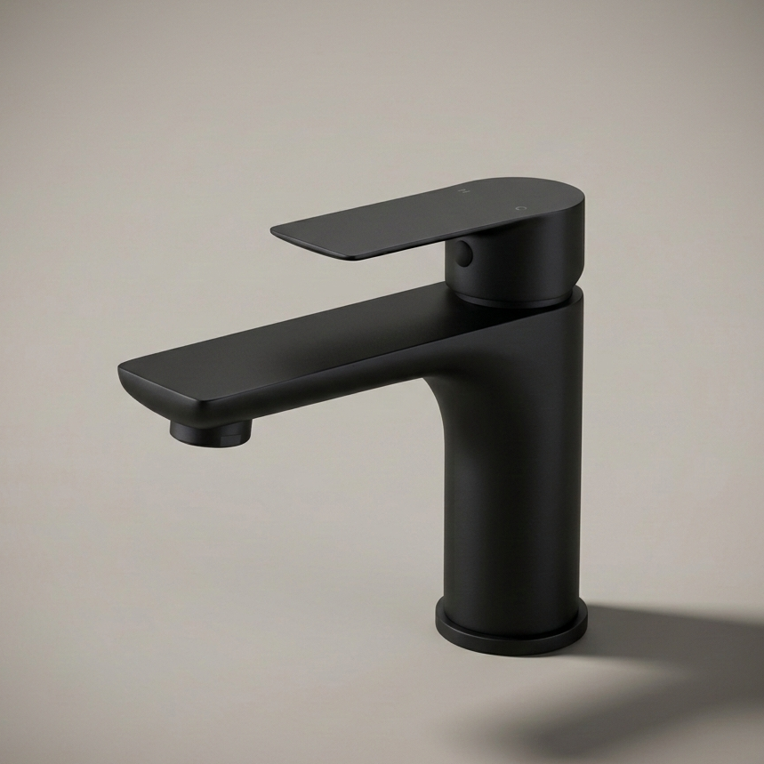 A modern, minimalist single-hole bathroom faucet made of stainless steel, installed on a white speckled quartz countertop against a white subway tile backsplash.