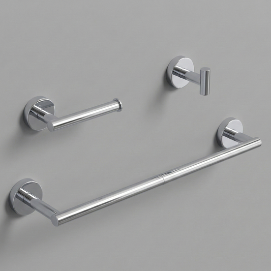 A luxurious, three-piece modern bathroom hardware set in a chrome finish, featuring a sleek 24-inch round towel bar, an anti-spin single-post toilet paper holder, and a minimalist cylindrical robe hook floating against a soft, neutral beige background.